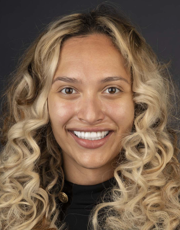 Young woman getting dental veneers and has white teeth