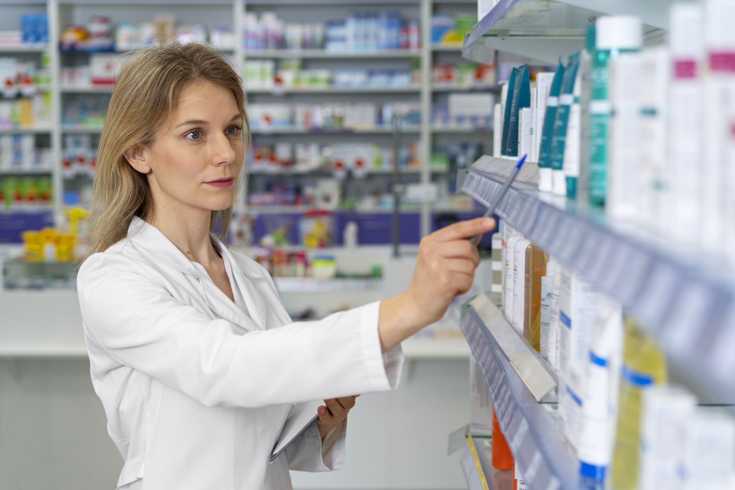 A  Pharmacist looking through medicines