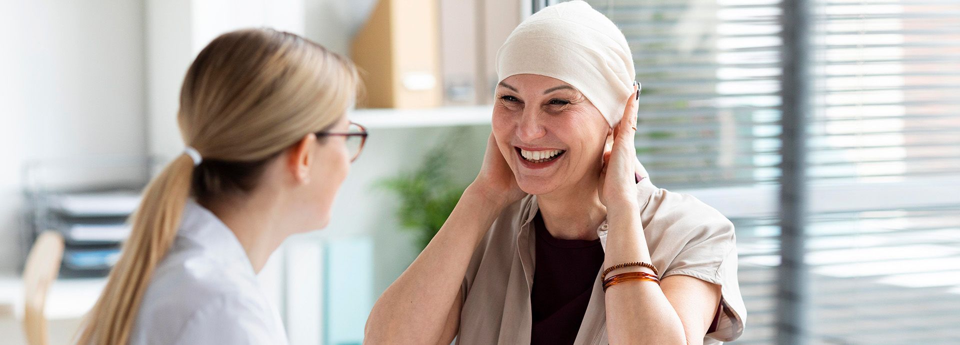 Smiling oncology patient with the oncologist 