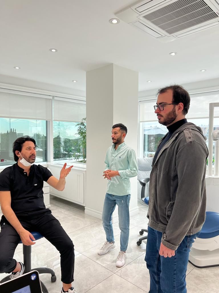 Dentist Giving Young Men Consultation